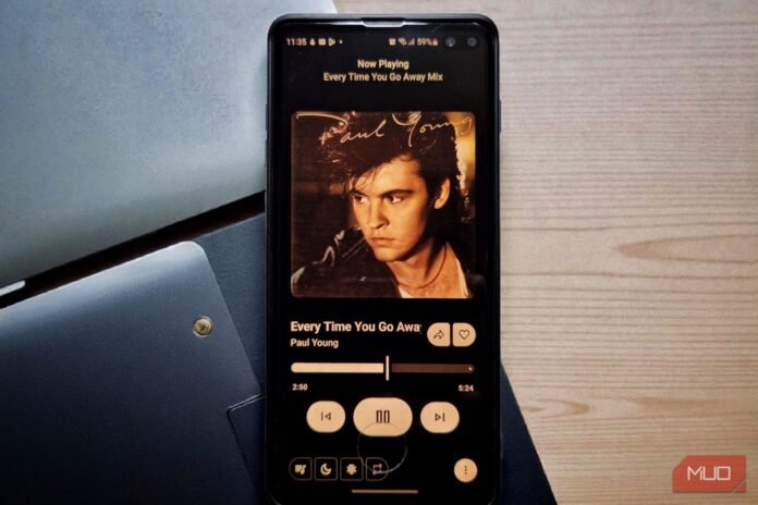 a-smartphone-on-a-desk-displaying-a-music-app-s-now-playing-screen